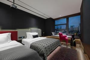 Voodi või voodid majutusasutuse Beso Designer Apartent Hotel toas