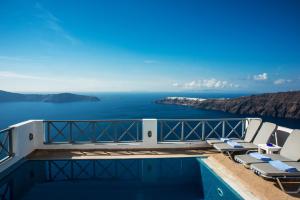 a view of the ocean from the deck of a cruise ship at Prekas Apartments in Imerovigli