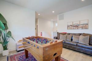 a living room with a foosball table at Spacious 3BR Home - Perfect Belgrade Getaway in Belgrade