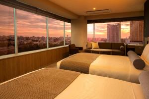 Postel nebo postele na pokoji v ubytování ART HOTEL Nippori Lungwood