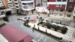 an aerial view of a city street with benches at Апартаменты возле метро in Baku
