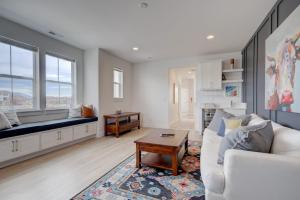 a living room with a white couch and a table at Yellowstone Country Outdoor Adventures Sleeps 6 in Belgrade