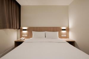 Postel nebo postele na pokoji v ubytování Nei Jiang Hotel