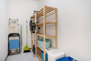 a room with a shelf next to a toilet at Casa Hueller Roncegno in Roncegno