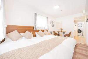 New-built APT at Asakusa-Skytree area with Tranquil block房間的床