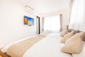 New-built APT at Asakusa-Skytree area with Tranquil block房間的床