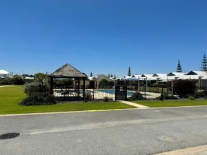 a building with a gazebo on the side of a road at Oh Bouy, Unit 62 Seafront Estate in Jurien Bay