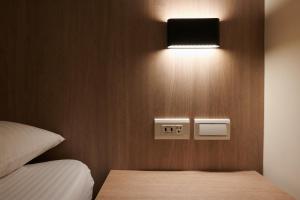 Postel nebo postele na pokoji v ubytování Nei Jiang Hotel