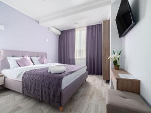Postel nebo postele na pokoji v ubytování Hotel Paris