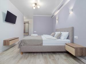 Postel nebo postele na pokoji v ubytování Hotel Paris