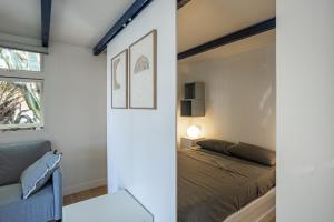 a bedroom with a bed and a window at Camping Bon Sol in El Campello