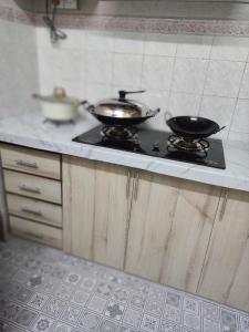 Kuchyň nebo kuchyňský kout v ubytování Imtiyaz Islamic Homestay + 2 fotografie