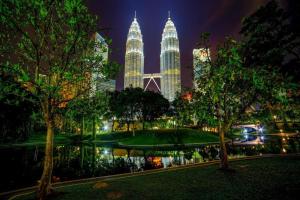 a view of the petronas towers at night at My Home Hotel Wangsa Maju in Kuala Lumpur