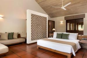 A bed or beds in a room at Jetwing Lagoon Wellness, A Luxury Reserve - Adults Only