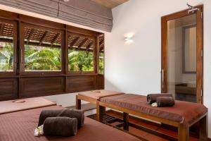 A bed or beds in a room at Jetwing Lagoon Wellness, A Luxury Reserve - Adults Only