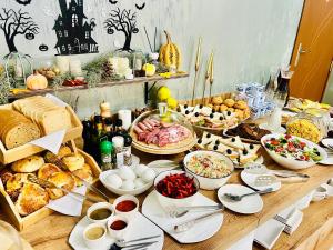 a table with many different types of food on it at DADIANI Inn in Zugdidi
