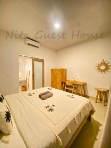 Postel nebo postele na pokoji v ubytování Nita Guest House Bali