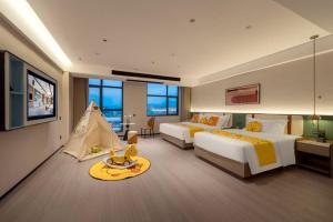 Ένα ή περισσότερα κρεβάτια σε δωμάτιο στο Mehood EZZI Hotel Kaili University South Railway Station