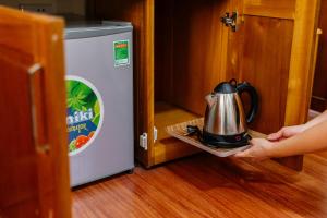Tetera y cafetera en Huy Hoan Hotel