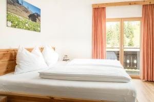 Postel nebo postele na pokoji v ubytování Aubauerngut
