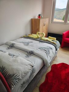 A bed or beds in a room at Apartman Zlatar-Vasiljevic