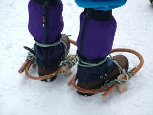 a person riding a horse in the snow wearing ski equipment at Awone Shirakami Juniko in Fukaura