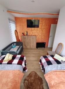 A bed or beds in a room at Apartman Zlatar-Vasiljevic