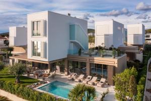 an aerial view of a house with a swimming pool at Villa Piano Turanj - Adriatic Luxury Villas in Turanj
