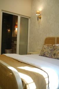 Ένα ή περισσότερα κρεβάτια σε δωμάτιο στο The Little Experience, Jaipur