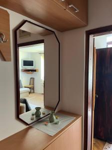 a mirror on top of a dresser in a room at Medo in Zlatibor