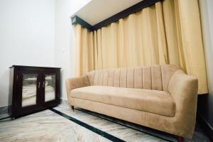 Posezení v ubytování Shri Krishna Sharanam Guest House