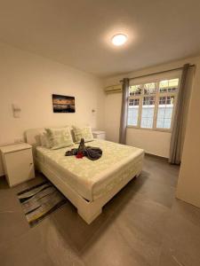 a bedroom with a bed and a large window at 3 BR Villa Agape with Pool in Tamarin +25 photos