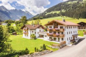 an aerial view of a house in the mountains at Penthouse Zirm Untermairhof in Selva dei Molini
