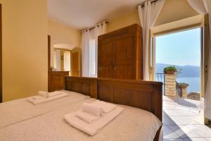 Ένα ή περισσότερα κρεβάτια σε δωμάτιο στο Rustico Kristi - Theater Home