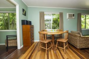 a dining room with a table and chairs at OurBonnieDoon in Arcadia +5 photos