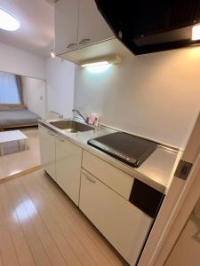 Kuchyň nebo kuchyňský kout v ubytování 401好立地札幌駅徒歩7分と大通駅徒歩6分で都心を満喫で綺麗な部屋で快適が生活が実現