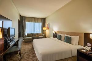 Una cama o camas en una habitación de Safir Hotel Doha
