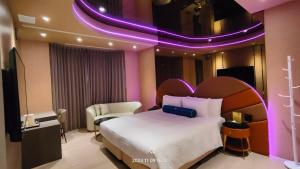 Voodi või voodid majutusasutuse Jiati Business Motel toas