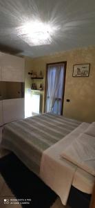 Ένα ή περισσότερα κρεβάτια σε δωμάτιο στο La casa di Lucia a Cerete +13 φωτογραφίες