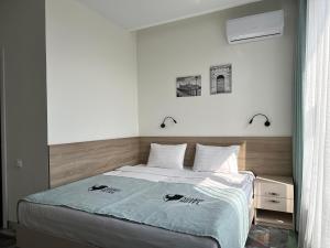 Postel nebo postele na pokoji v ubytování Scandi Hotel