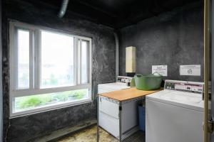 Kuchyň nebo kuchyňský kout v ubytování WORK INN TPE