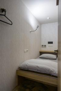Postel nebo postele na pokoji v ubytování WORK INN TPE