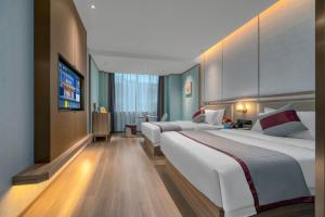 Postelja oz. postelje v sobi nastanitve Morning Hotel Changsha Wangcheng Economic Development Zone