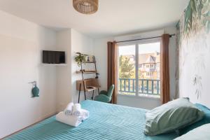 Katil atau katil-katil dalam bilik di Les pins 205 - Appt 400m de la plage