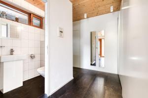 a bathroom with a toilet and a sink at Panorama Chalet Bellavista in Brand