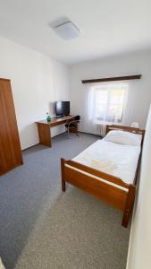 Rúm í herbergi á Nobiles hotel Šternberk