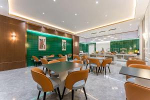Restaurace v ubytování Mehood EZZI Hotel Jinan Olympic Sports Center Environmental Trade Center