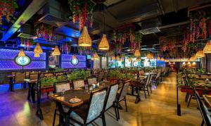 A restaurant or other place to eat at Treebo Imperia, Kommadi