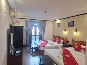 Postel nebo postele na pokoji v ubytování Luang Prabang Pavilion Hotel & Travel + 37 fotografií