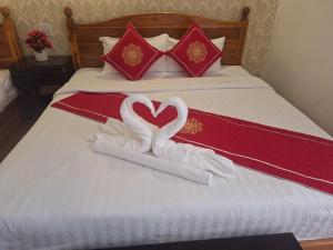 Postel nebo postele na pokoji v ubytování Luang Prabang Pavilion Hotel & Travel